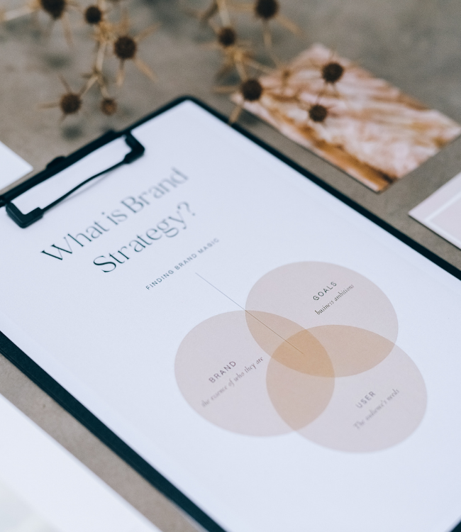 Brand strategy notebook and pen on a desk